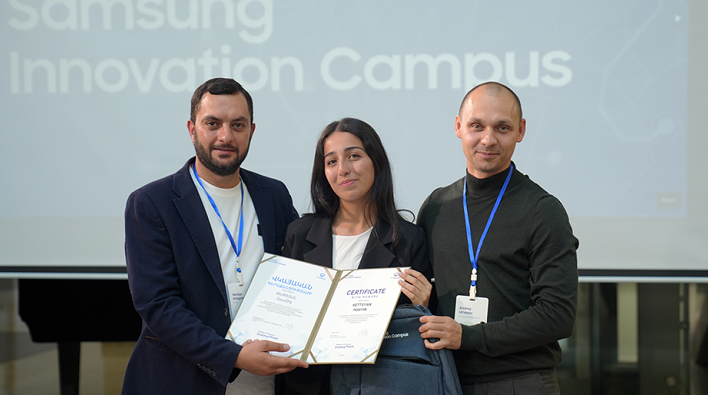 A student receiving an award at the Samsung Electronics Innovation Campus